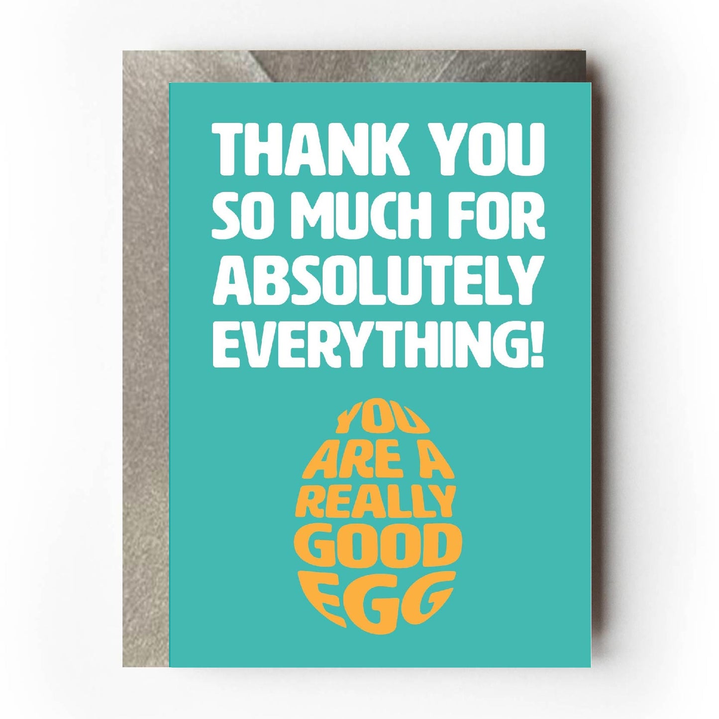 Text on card is white and yellow against a teal background and states "Thank you so much for absolutely everything!" In the shape of an egg, further yellow text states "You are a good egg" Card measures 105 x 150mm and is supplied with a very striking pewter-effect eco-Kraft envelope.