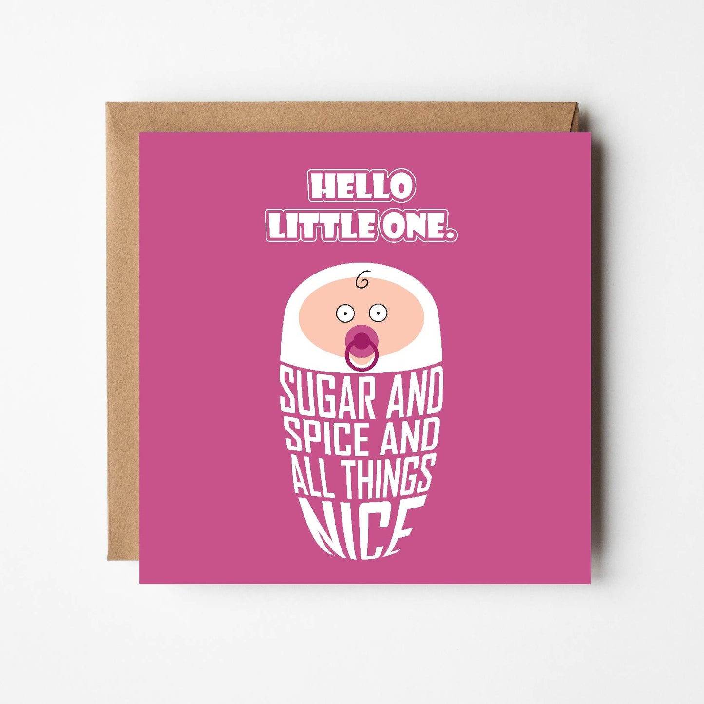 Card titled Hello Little One in white text on pink background. Cartoon baby is swaddled in lettering which reads “Sugar and spice and all things nice.” Card is 150mm square and supplied with eco-Kraft envelope.