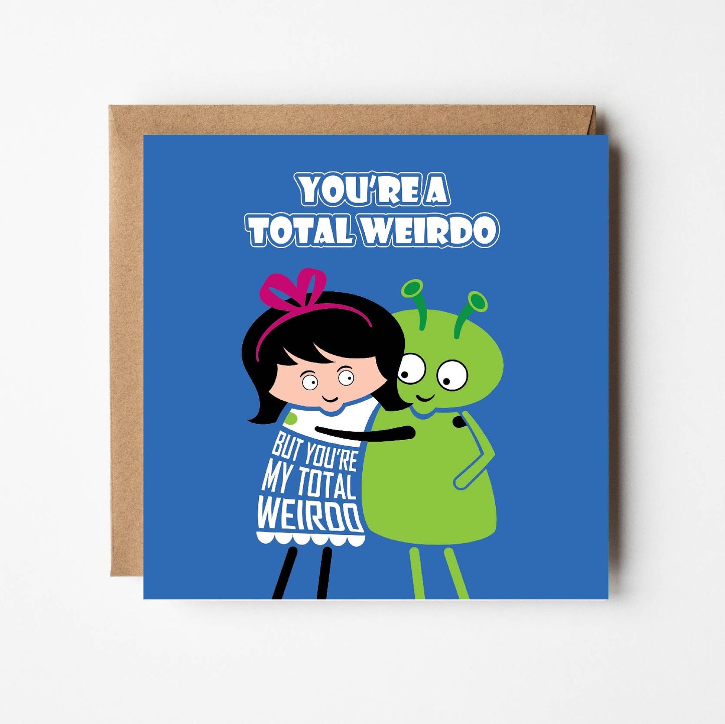 Card text states "You're a total weirdo but you're my total weirdo" with image of a cartoon lady lovingly hugging an alien.