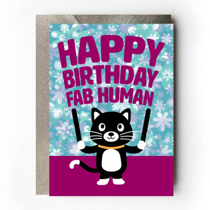 Birthday card with a cartoon cat holding 'Happy Birthday Fab Human' sign on a floral background.