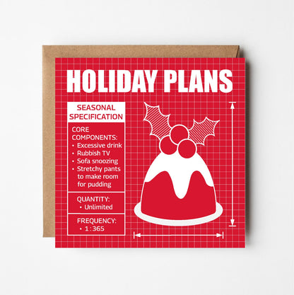 Greeting card with Christmas pudding illustration and text in style of blueprint plans on a red background.