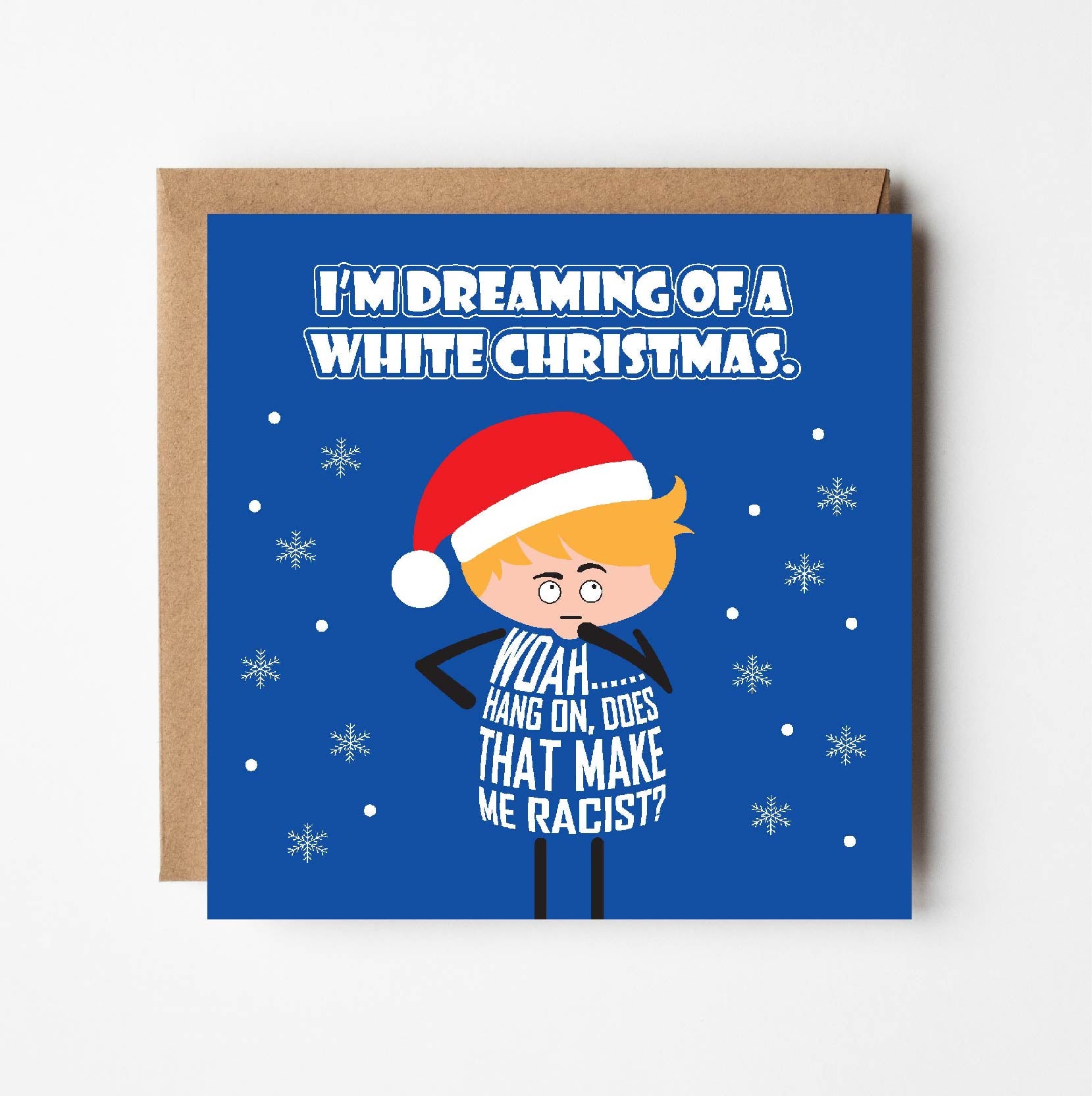 Card titled Dreaming of a White Christmas.  A car toon character who is white, wears a Santa hat while it snows.  He queries Woah, hand on. Does that make me racist?  Card is 150mm square with eco-Kraft envelope.
