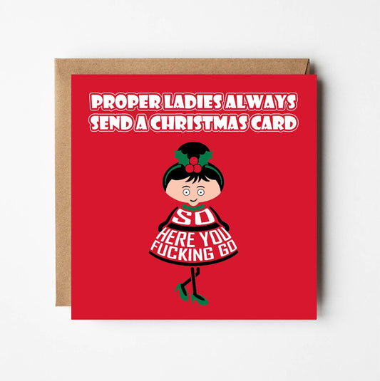 Card titled Proper ladies always send a Christmas card. A cartoon lady in a pretty dress and high heels then says So here you fucking go.  Card is 150mm square and supplied with eco-Kraft envelope.   