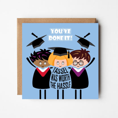 Funny graduation card with cartoon graduates tossing caps in air with 'Tassel was worth the hassle' text on a blue background