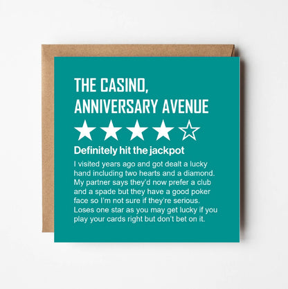 Funny anniversary card styled as a four-star online review of The Casino, Anniversary Avenue, with kraft envelope