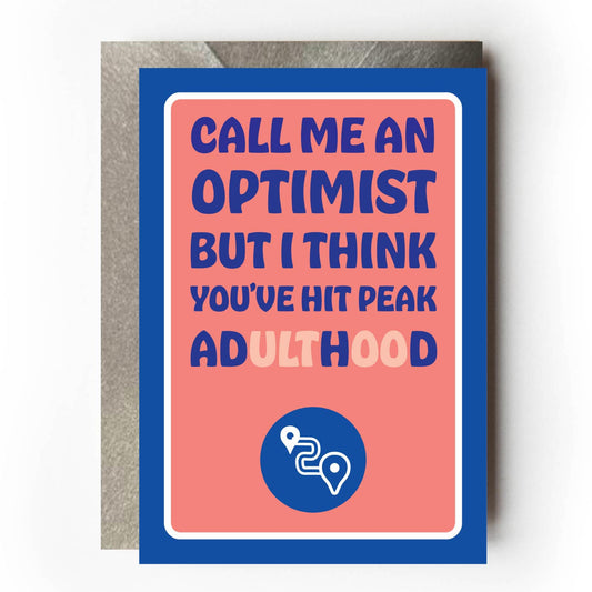 Funny greeting card with text 'Call me an optimist but I think you've hit peak adulthood / ADHD' on an orange background with blue border.
